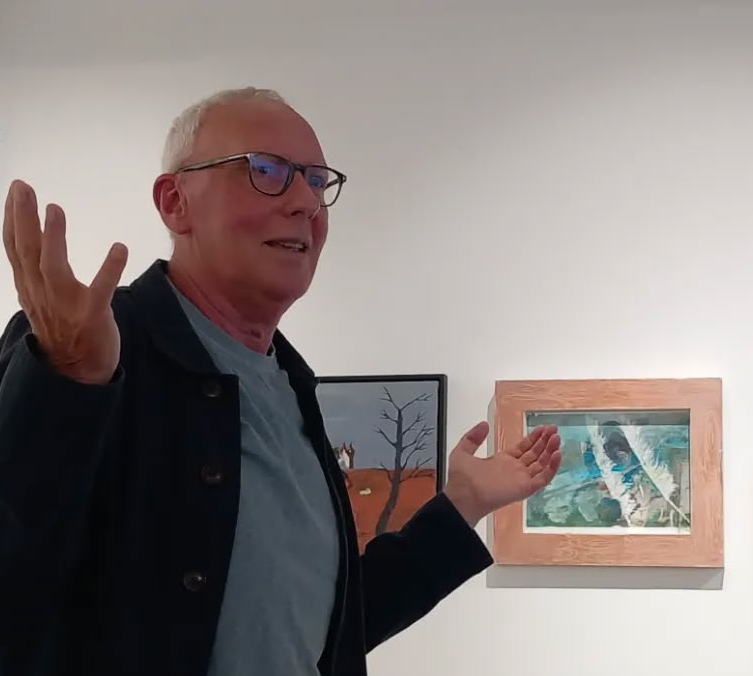 Michael Archer giving a talk about pictures at en exhibition